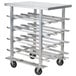 A Regency aluminum mobile can rack with aluminum top on a metal cart with wheels.