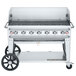A Crown Verity stainless steel outdoor rental grill on wheels.
