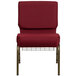 A Flash Furniture burgundy church chair with metal legs.