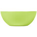 A green round bamboo salad bowl with a white background.