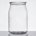 An American Metalcraft clear plastic drink can with a lid on a white surface.