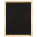 A black Aarco felt message board with a wooden frame.