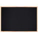 A black chalk board with a solid oak frame.