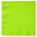 A close-up of a Creative Converting Fresh Lime Green paper napkin with a corner edge.