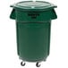 A green Rubbermaid BRUTE trash can with lid and wheels.