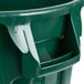 A green Rubbermaid commercial trash can with a lid and dolly.