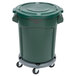 A green Rubbermaid BRUTE trash can with a lid and dolly.