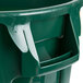 A green Rubbermaid BRUTE trash can with lid and dolly handles.