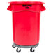 A red Rubbermaid BRUTE trash can on wheels.