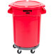 A red Rubbermaid BRUTE trash can with wheels and lid.