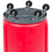 A red barrel with black wheels.