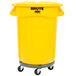 A yellow Rubbermaid trash can on wheels with a lid.