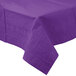 A Creative Converting amethyst purple table cover on a table with a white background.