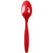 A red Creative Converting heavy weight plastic spoon on a white background.