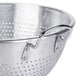 A Vollrath heavy-duty aluminum colander with handles and a base.