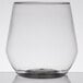 A clear plastic WNA Comet stemless wine goblet with a small amount of liquid in it.