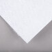 A white paper with a gray edge on top of a gray surface.