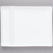 A white rectangular Libbey porcelain plate with two small square cutouts.