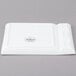 A white rectangular Libbey porcelain plate with two compartments.