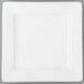 A Libbey ultra bright white porcelain square plate with a white rim on a gray surface with a fork.