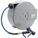 A grey T&amp;S steel hose reel with a blue hose attached.