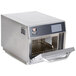 A silver Bakers Pride E300 High-Speed Accelerated Cooking Countertop Oven with a door open.