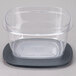 A Rubbermaid clear plastic container with a lid.