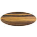 An oval faux acacia melamine serving board on a wood table