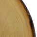 An American Metalcraft round melamine serving board with a faux rustic wood finish.