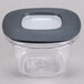 A Rubbermaid clear plastic square storage container with a black lid.