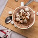 A cup of Ghirardelli hot chocolate with marshmallows on top.