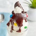 A chocolate ice cream sundae with Ghirardelli milk chocolate topping and cookies.
