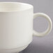 A close-up of the handle of a white Arcoroc stack cup.
