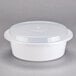 A white Pactiv plastic container with a plastic lid.