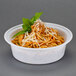 A Pactiv Newspring white plastic bowl filled with spaghetti, topped with cheese and basil.