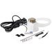 A white Dema 8400 Top Shot One chemical laundry pump with black and white wires and a plastic tube.
