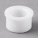 A white plastic upper shaft bearing for a Last Call glass washer.