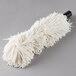A white mop for a Bar Maid glass washer on a grey surface.