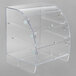 An extra large clear acrylic bakery case with three shelves.