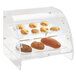 A clear acrylic bakery display case with bread and pastries on trays.