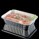 A Durable Packaging rectangular foil container with food inside.