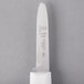 A Mercer Culinary clam knife with a white textured poly handle.