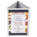 A Menu Solutions Alumitique triple view menu displayette with a brushed aluminum finish holding a menu of desserts on a white surface.