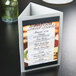 A brushed aluminum Menu Solutions triple view table tent on a table.