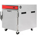 A large metal Vulcan Half Size Insulated Heated Holding and Transport Cabinet on wheels.