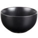 A close up of a 10 Strawberry Street Wazee Matte black stoneware bowl.