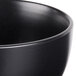 A close up of a 10 Strawberry Street Wazee Matte black stoneware cereal bowl.