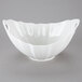 A white porcelain boat bowl with a wave texture.