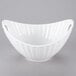 A white porcelain boat bowl with a curved edge.
