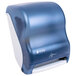 A white and blue San Jamar hands free paper towel dispenser.
